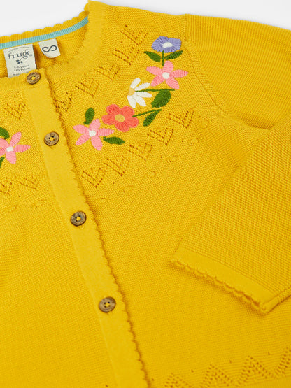 Kofta blommor och hålmönster