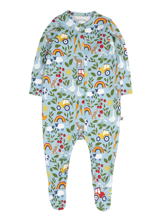 Ekologisk babypyjamas från Frugi med färgglatt tryck med bondgårdstema